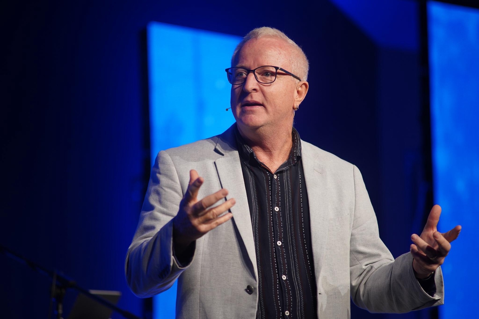 Lex Akers speaking on stage